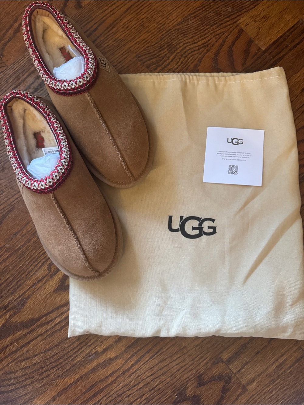 UGG slippers .  Brand new with Bag